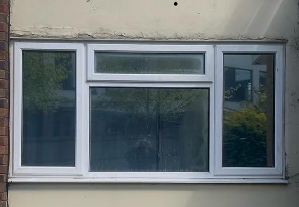 Tinted triple window controlling heat, glare and UV